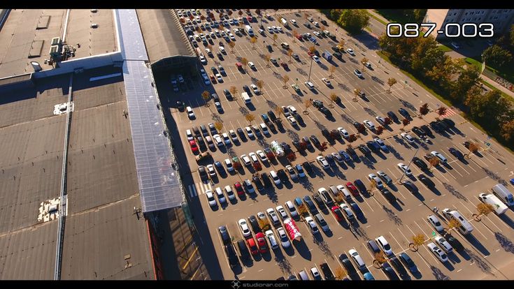 Vertical view of cars at shopping center parking lot – Drone Aerial Photograph...