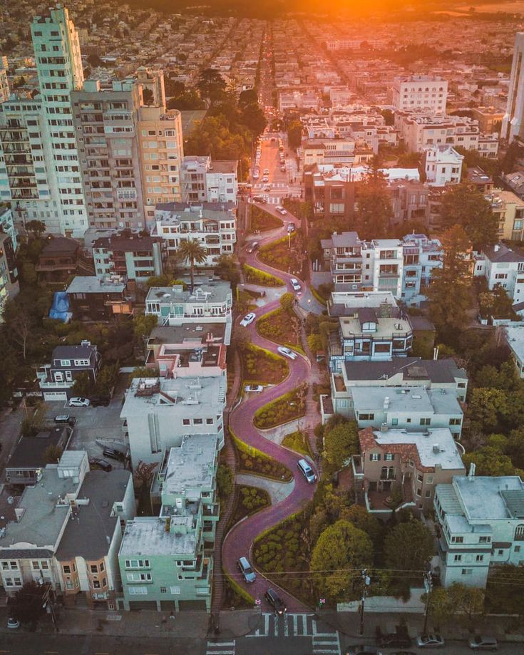 Lombard Street in #sanfrancisco, #sunset poking through the back of the view. #d...