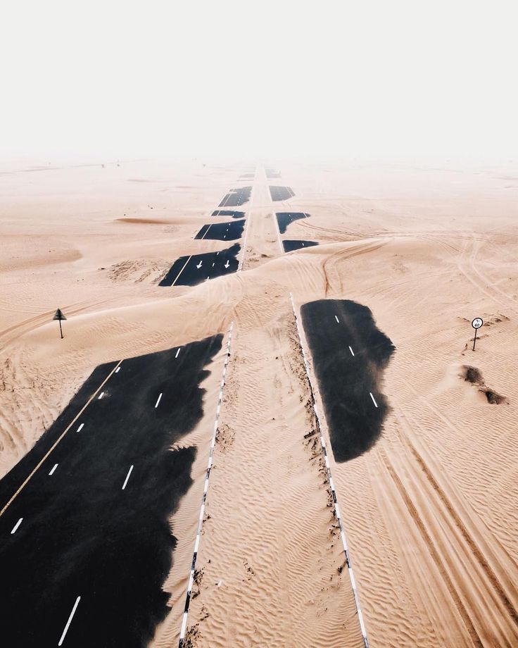 These aerial shots of Dubai's highways, swept over by desert sandstorms, are...