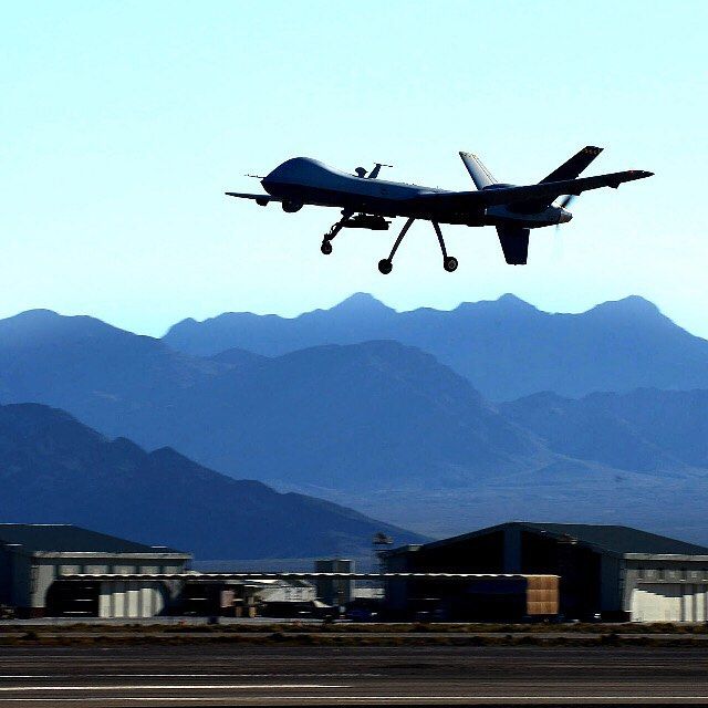 An MQ-9 Reaper performs touch-and-go flight patterns June 13, 2014, at Creech Ai...