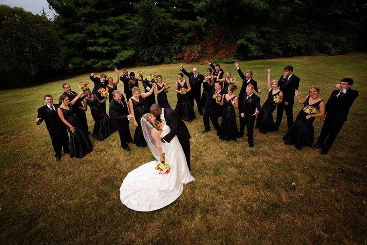 I love photos like this, where the bridal party is like hootin' and hollerin' for the kiss :) #dronephotography