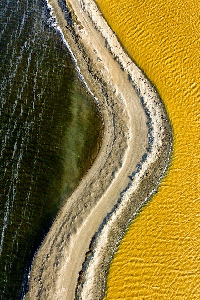 Supernatural colors and incredible shades captured by Chris Benton flying over the salt lakes of South Bay California.