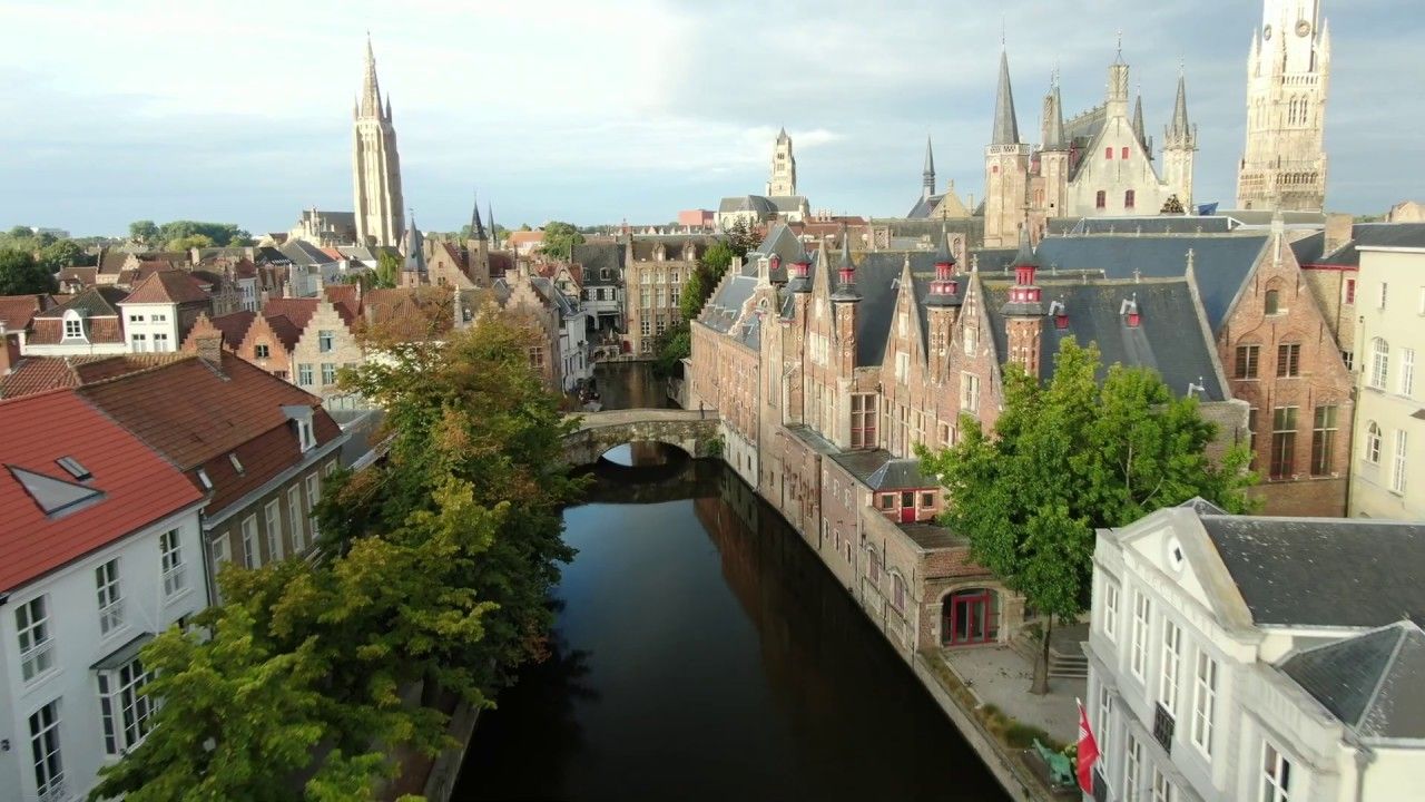 Brugge aerial view flying over canal