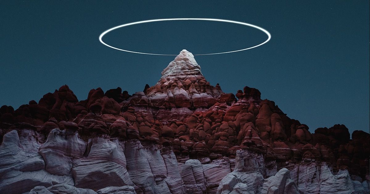 Long Exposure Photos Capture Drones “Painting” Light Halos Over Mountains